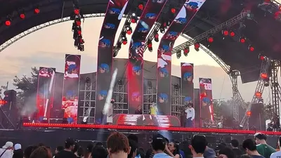 Concert stage with LED screens at an open-air township venue