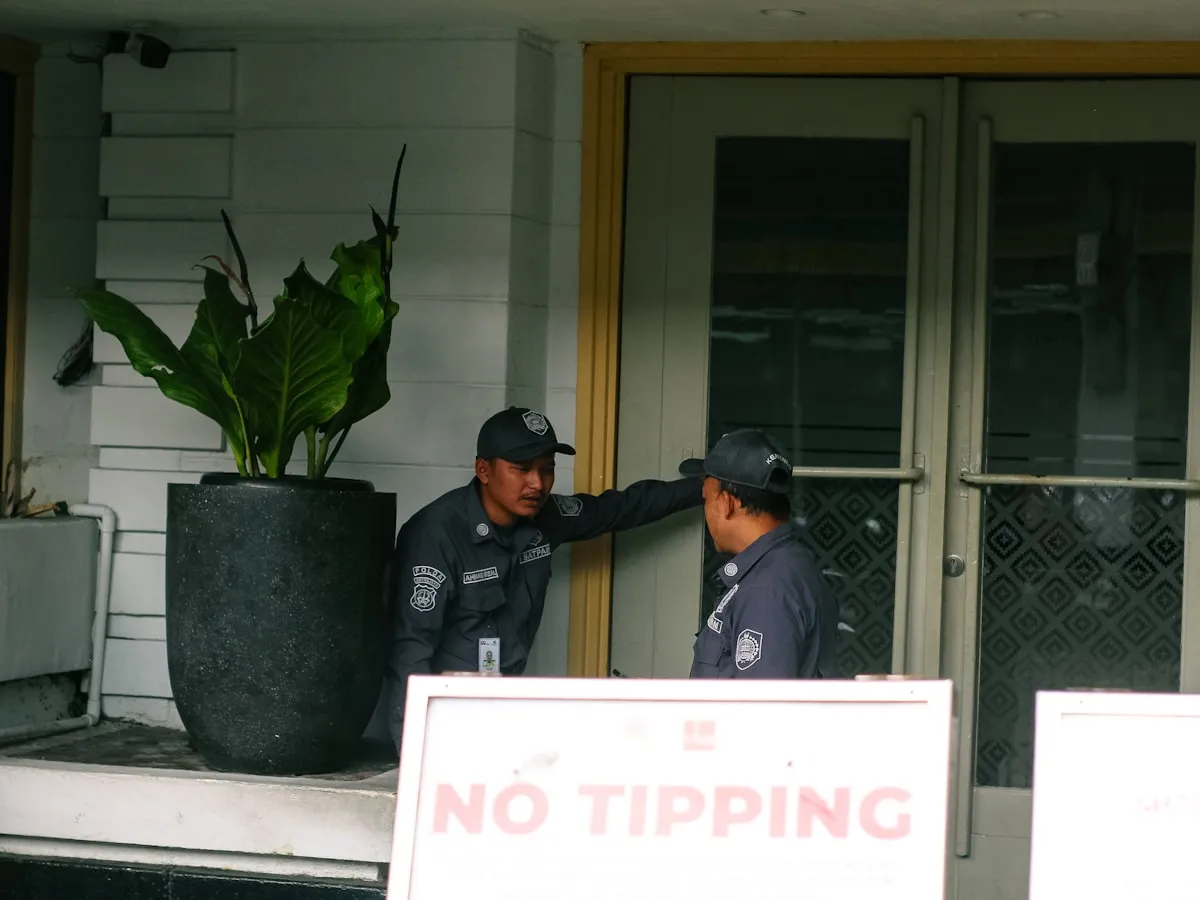 Security guards at a residential building entrance in Davao